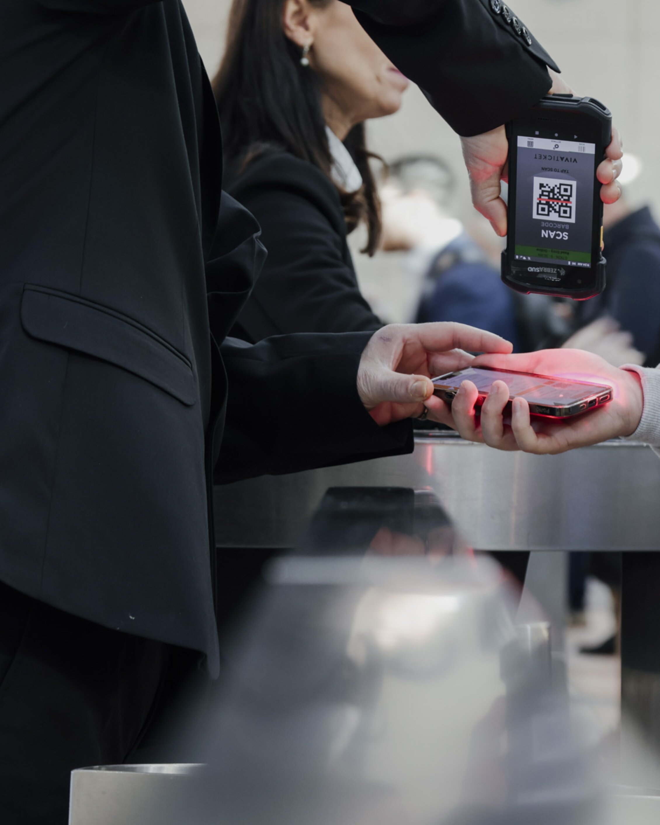 Rimini expo centre's employees scanning the visitors’ digital tickets at the entrance to KEY
