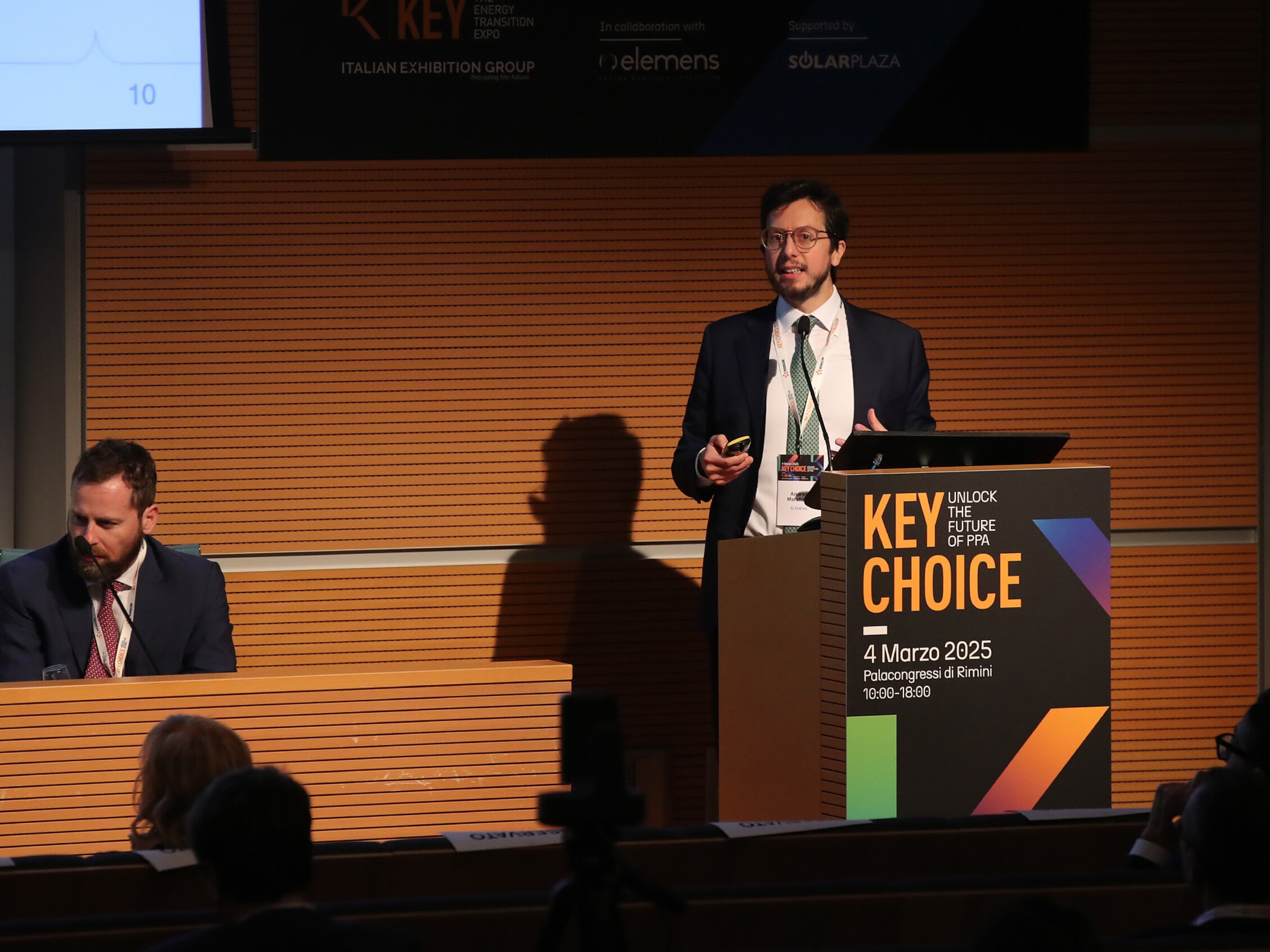 a speaker is talking into the podium microphone during the event KEY Choice – Unlock the Future of PPA, held on March 4th, 2025 at the Rimini Conference Center