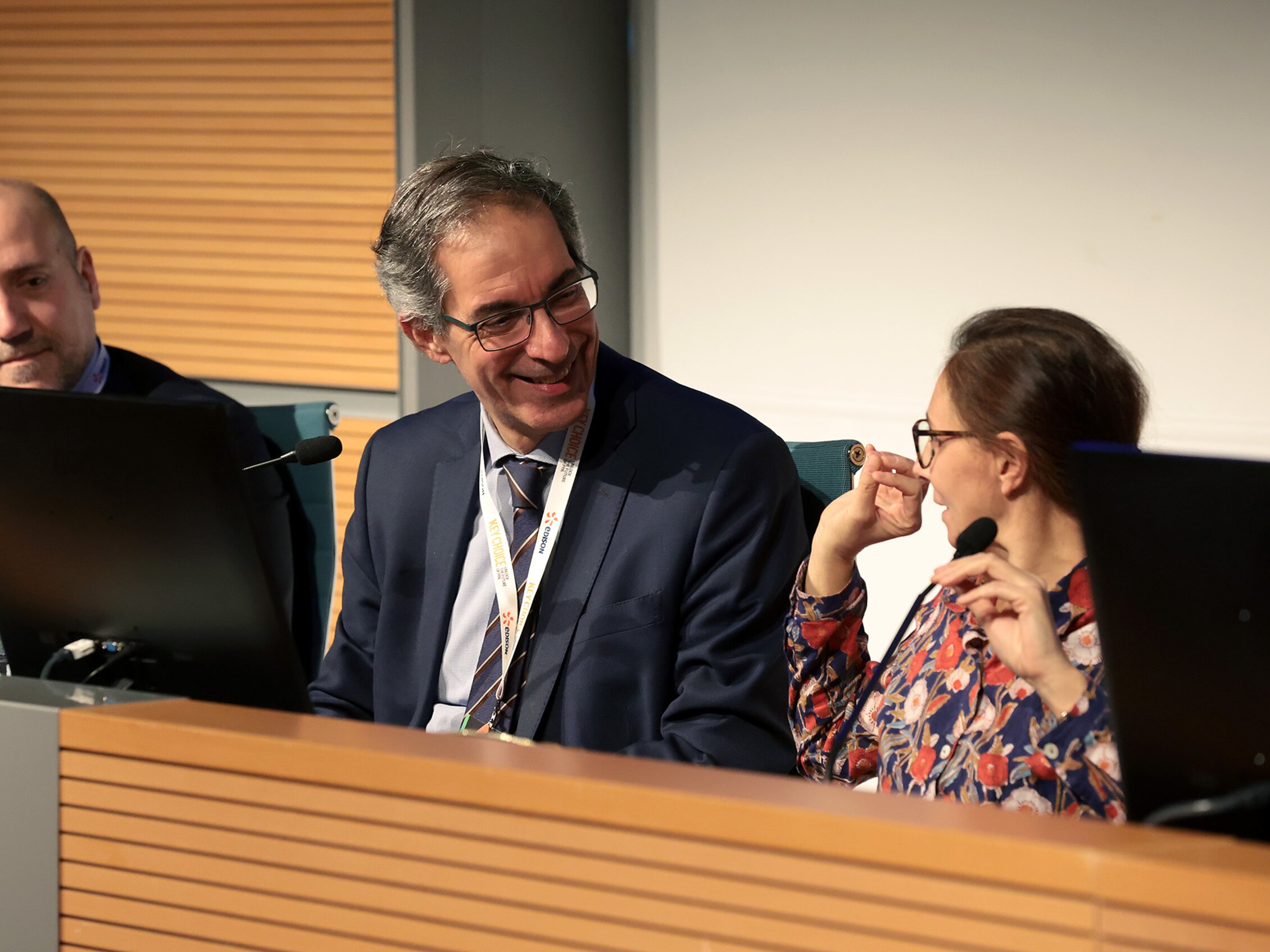 three smiling people seated at the speakers' table during the KEY CHOICE 2026 event