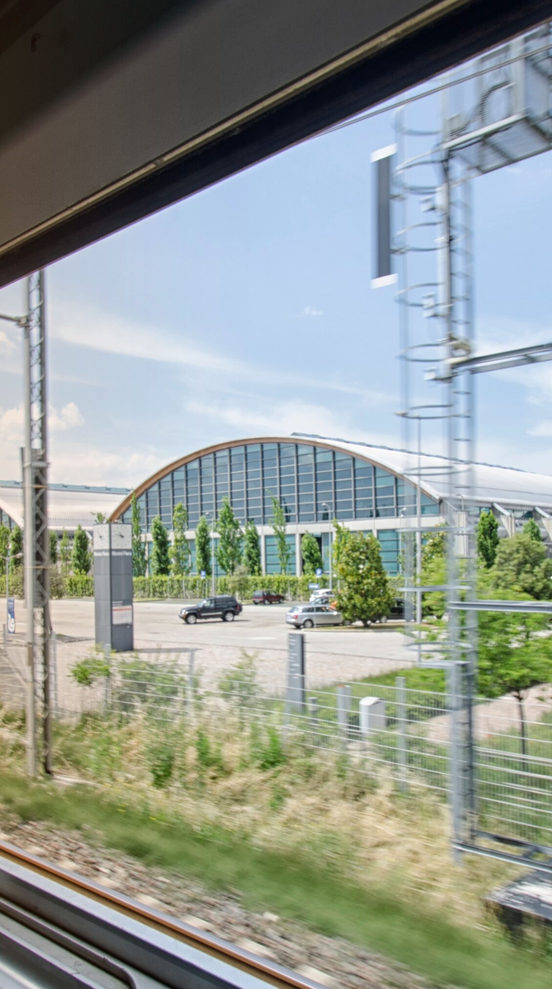 rimini expo centre seen through the window of a train