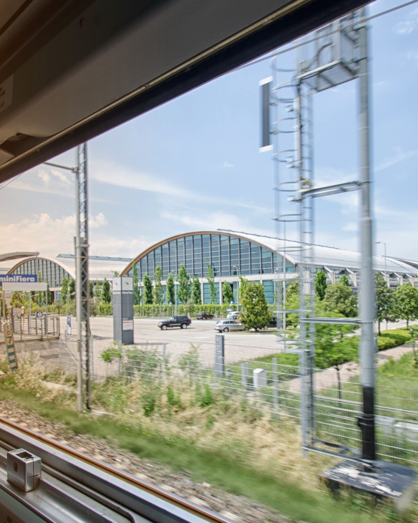 rimini expo centre seen through the window of a train