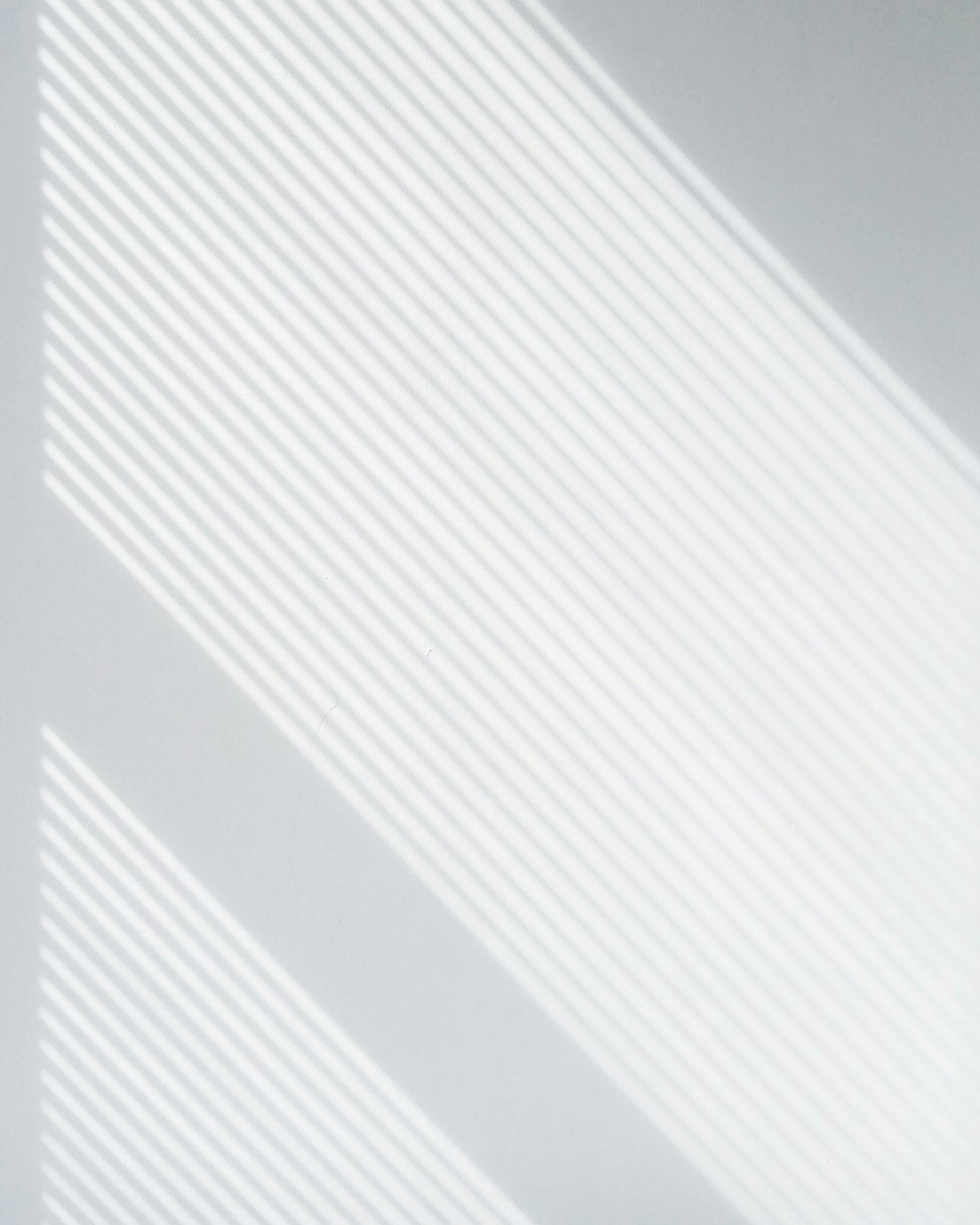 pattern of light and shadows on a light surface